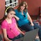 Mother looks at her internet addicted teen daughter