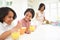 Mother Making School Packed Lunches For Children