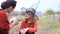 Mother painting bat mask on little daughters face