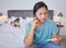 Mother phone call doctor for sick child, virus and fever in bedroom at home. Worried Taiwan parent consulting mobile