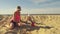 Mother playing with child on the beach