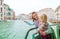 Mother pointing out sights to daughter while on a boat ride