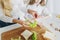 Mother preparing sandwich school lunch table close up