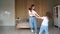 Mother and preschooler daughter perform dancing moves