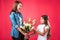 Mother presenting bouquet of flowers to daughter