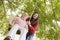 Mother pushing daughter on swing