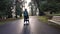 Mother pushing Stroller with Baby on Seawall. Stanley Park. Sunny, Fall Season. Downtown Vancouver