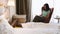 Mother is reading book while child is slipping in hotel