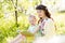 Mother reading book to baby outdoors