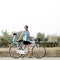 Mother riding a bicycle with her son