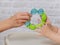 Mother\'s and baby hands with a new toy