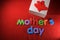 Mother`s Day alphabet blocks arranged on red background. Mother`s day gift box. Mother`s day concept.