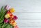 Mother\\\'s Day banner layout with copy space with colorful tulip flowers on a wooden table