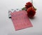 Mother`s Day gifts. Flowers, a present and handmade greeting card with message in Italian â€œBuona festa della mammaâ€.