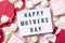 Mother`s Day lightbox message with white flowers and hearts