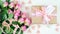 Mother`s Day overhead with gift and pink roses on white wood table background