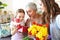 Mother`s day! three generations of  family mother, grandmother and daughter congratulate on the holiday, give flowers