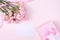 Mother`s Day, Valentine`s Day background design concept, beautiful pink carnation flower bouquet on pastel pink table, top view,