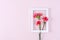 Mother`s Day, Valentine`s Day background design concept, beautiful pink, red carnation flower bouquet on pink table, top view,