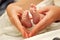 Mother\'s hands and tiny feet
