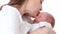 Mother`s kiss. Mom kisses the newborn baby. Mothers Day. Maternity in slow motion. Family concept. Slow Motion
