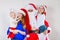 Mother, Santa and two daughters christmas family photo