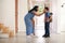 Mother Saying Goodbye To Son As He Leaves Home For School