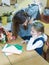 Mother says goodbye to her daughter a primary school student