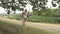 Mother shakes the girl on a swing. A child with his mother for a walk walks in the park on a day off. Teamwork. Family