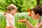 Mother showing poppy flower