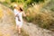 Mother shows beautiful places to her little son while walking in nature.