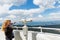 Mother shows son landscapes in valley of Rhodope Mountains and sky through telescope on observation tower of Snezhan