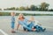 Mother sitting on a ground with her daughter and son