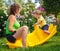 Mother sitting with her son on baby swing