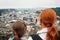 Mother and son admire a city with an observation deck of Hohensalzburg. Austria, Salzburg. Family sightseeing.