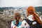 Mother and son admire a city with an observation deck of Hohensalzburg. Austria, Salzburg. Family sightseeing.