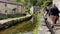 Mother and son admiring the view of Castleton Village with the river running through