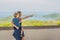 Mother and son in the background of Tropical beach landscape panorama. Beautiful turquoise ocean waives with boats and sandy coast