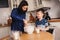 Mother and son baking cake in the kitchen. Lifestyle casual capture of family cooking