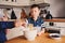 Mother and son baking cake in the kitchen. Lifestyle casual capture of family cooking