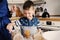 Mother and son baking cake in the kitchen. Lifestyle casual capture of family cooking