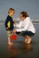 Mother and Son at beach with Red Bucket