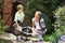 Mother And Son Cleaning Bike Together