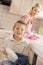 Mother And Son Cleaning Dishes