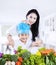 Mother and son cooking vegetable salad