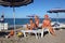 Mother, son and daughter sitting on beach