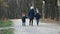 Mother, son and daughter walk in the Park in medical masks in the spring. The concept of protection FROM covid-19 coronavirus
