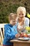 Mother And Son Decorating Easter Eggs