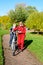 Mother and son in the foreground in the autumn Park in a medical mask. Parents teach their children