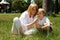 Mother and son on a glade near the house